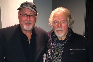 Randy Bachman with an arm on the shoulder of Charles Cozens